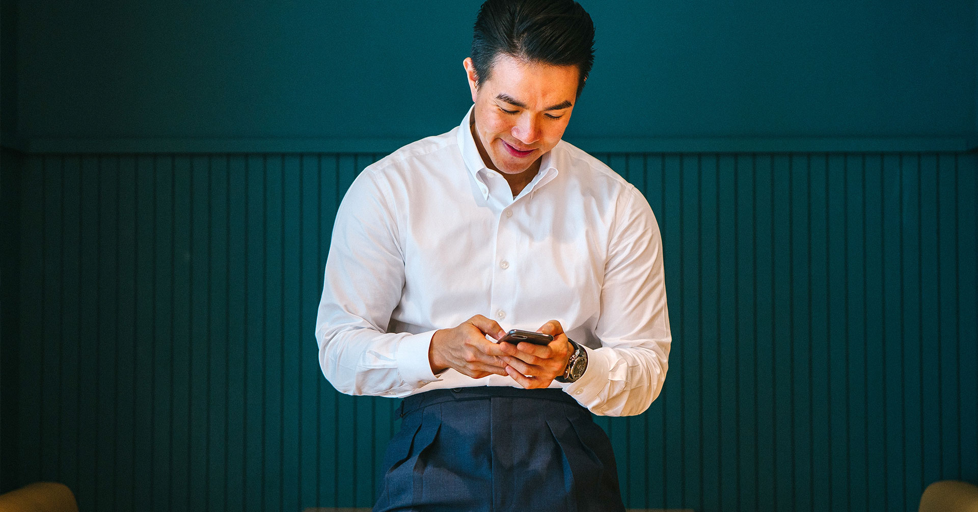 Man on phone omega watch