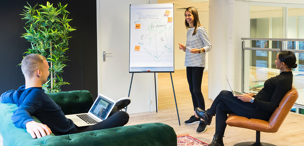 Woman giving presentation omega online personal services